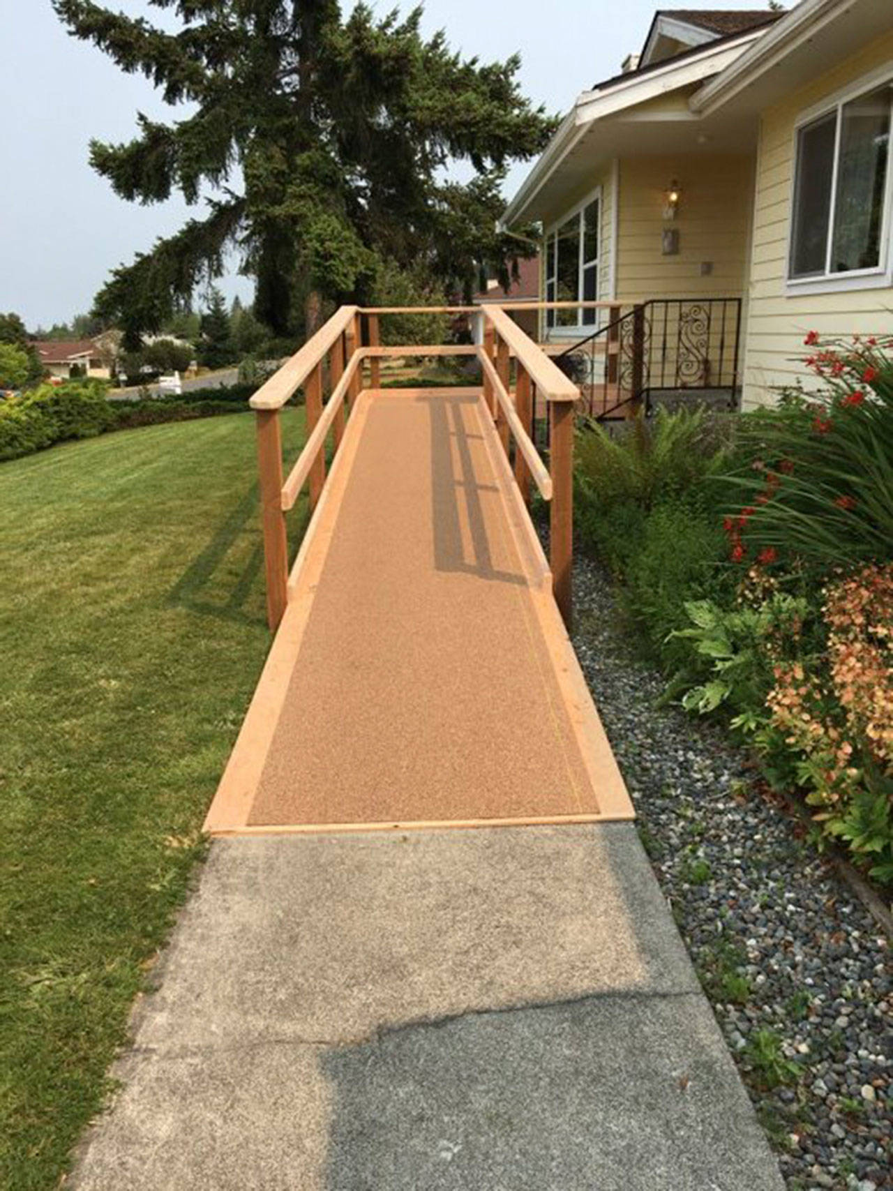 Over the weekend of Aug. 5-6, members from the 
Sequim Sunrise Rotary Club, Sequim Food Bank and other volunteers built a ramp for Sawyer Streett upon his return home. The volunteers also worked over the weekend to complete a list of 2017 yard projects Robert had made to finish. Submitted photo