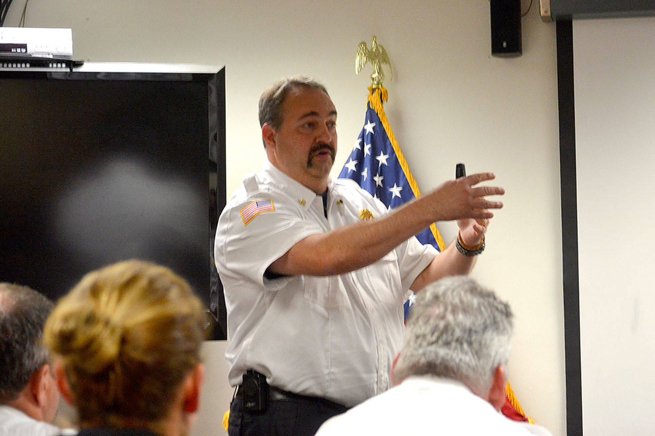 Fire commissioners considering grant to add six firefighters