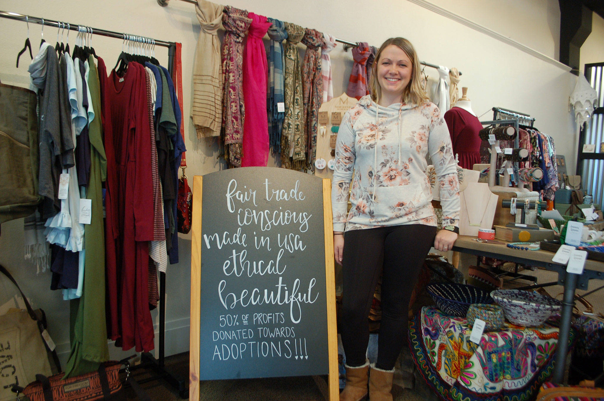 Chelsea Dutta stands in her and her husband’s fair trade boutique Amma’s Umma in Port Angeles where the proceeds go to families who wish to adopt and adoption efforts. Sequim Gazette photo by Erin Hawkins