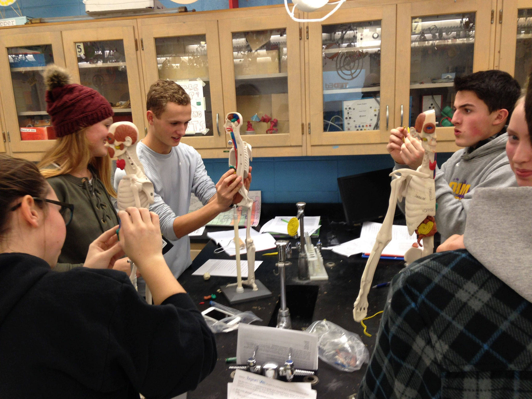 Sequim High School human body systems students Maggie Van Dyken, Emily Bundy, Liam Payne, Thomas Hughes and Abby Norman mold and place body parts on a mannequin as part of their learning course. Submitted photo