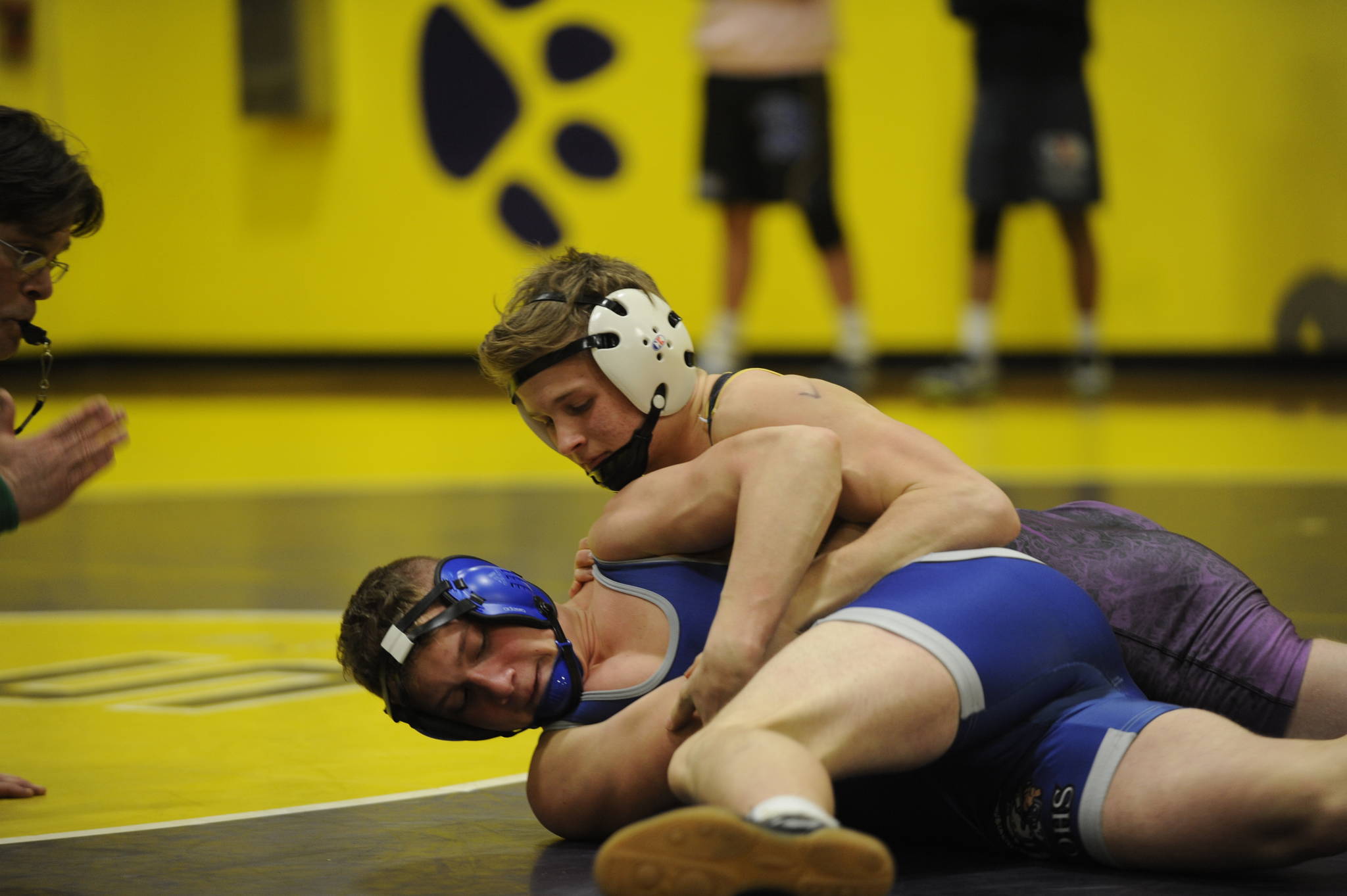 Sequim’s Ben Newell earned a spot to regionals at 145 pounds. Here he positions himself against Olympic’s Jonathon Beaulieu but won by injury default. Newell pinned his final two opponents to take third place. Sequim Gazette photo by Matthew Nash