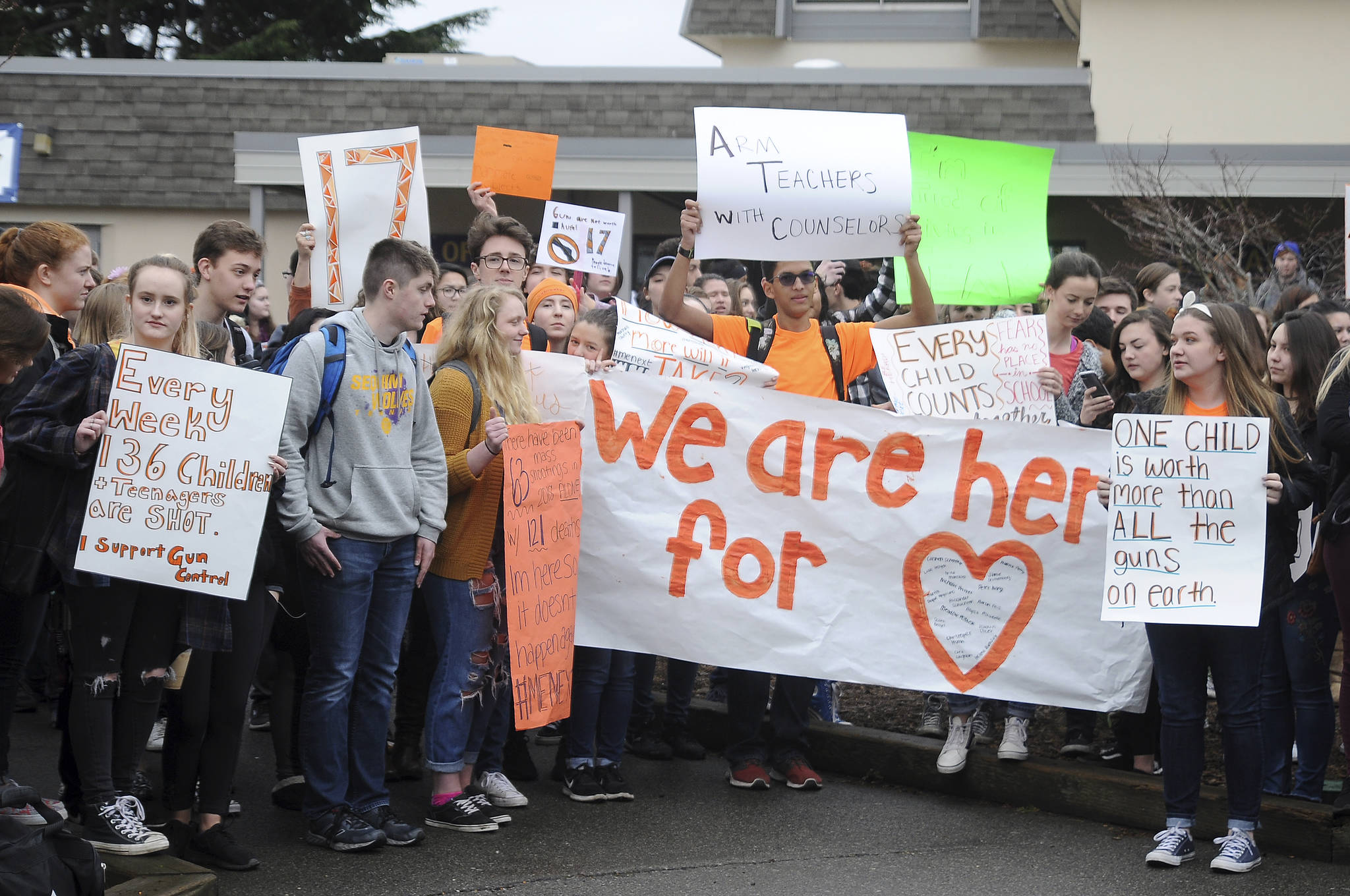 About 100 Sequim High School students take break from classes to express their views about gun control laws during the National School Walkout on Wednesday, March 14. Along with students across the country, SHS students offered up a variety of views on the school campus at 10 a.m. for a 17-minute demonstration — one minute for each of the 17 people killed at Florida’s Marjory Stoneman Douglas High School one month ago. Sequim Gazette photo by Michael Dashiell                                About 100 Sequim High School students take break from classes to express their views about gun control laws during the National School Walkout on Wednesday, March 14. Sequim Gazette photo by Michael Dashiell