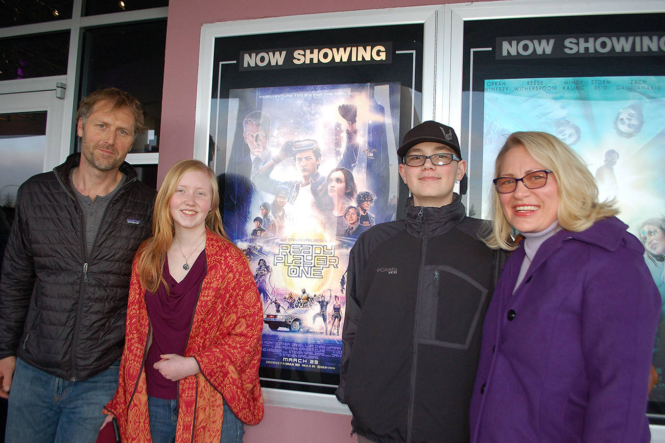 In honor of Robby Streett, his family and friends filled the theater at Deer Park Cinema on March 30 for the showing of his favorite book adapted into a film, “Ready Player One.” Josh Gloor, left, Robby’s girlfriend Hannah Gloor, Robby’s mother Josslyn Streett and younger brother Sawyer Streett were among those who watched the film and celebrated Robby’s love for the book. Sequim Gazette photo by Erin Hawkins