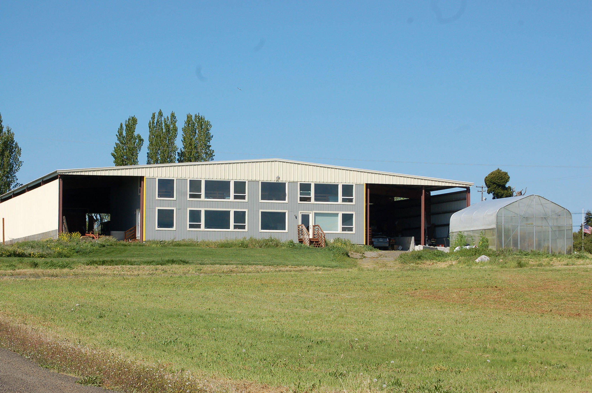 Tom Ash’s tier 2 marijuana producer business Tropic Grow LLC was the first in Sequim and on the North Olympic Peninsula to grow and produce marijuana. His business is now threatened to close its doors after permits on the building expired. Sequim Gazette photo by Erin Hawkins