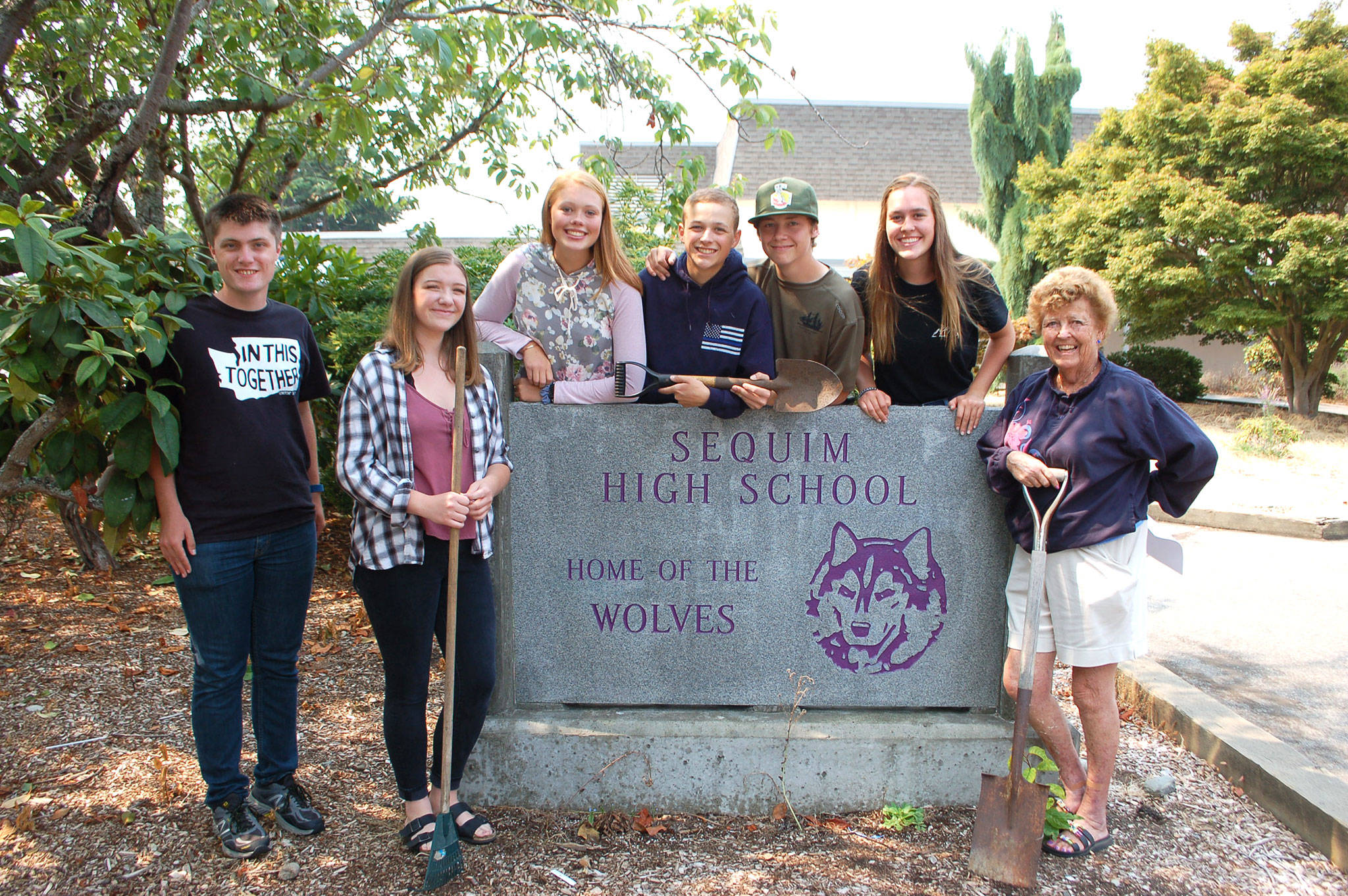 Students and volunteers are gearing up to provide a campus cleanup of Sequim High School from 8 a.m.-3 p.m. on Saturday. Aug. 18. From left, Sequim High School students Liam Braaten, Payton Sturm, Emily Bundy, Nicholas D’Amico, Hunter Wells, Katie Potter and volunteer Emily Westcott go over details of this weekend’s cleanup. Westcott says volunteers will meet in the high school parking lot, can volunteer for any amount of time he or she would like and beverages and snacks will be provided. Sequim Gazette photo by Erin Hawkins