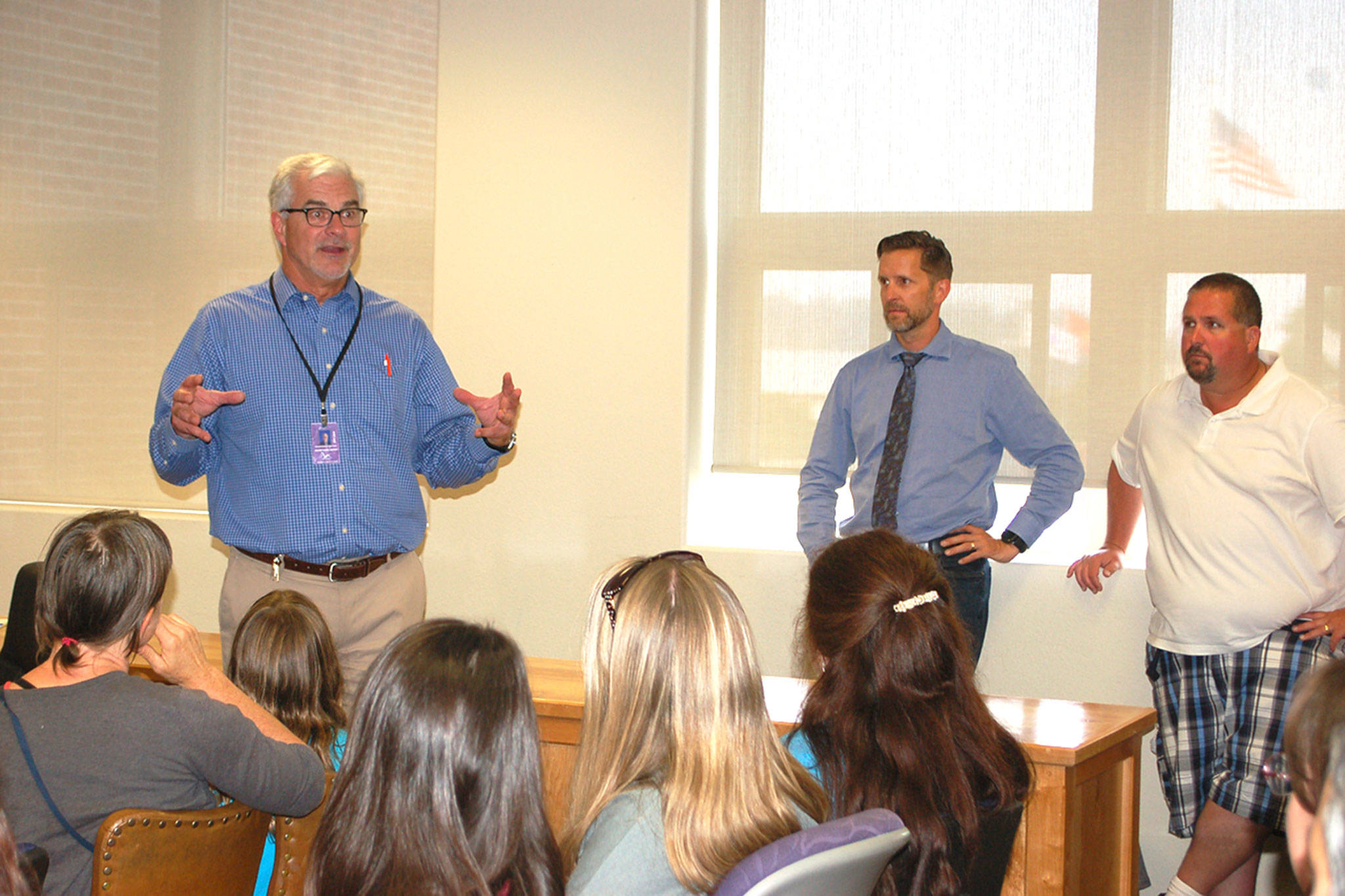 Sequim Schools Superintendent Gary Neal speaks to Olympic Peninsula Academy Parent Teacher Organization members, parents and staff on Aug. 15 at the district board room to go over details for the alternative education program’s temporary housing as the district finishes its capital projects. Sequim Gazette photo by Erin Hawkins