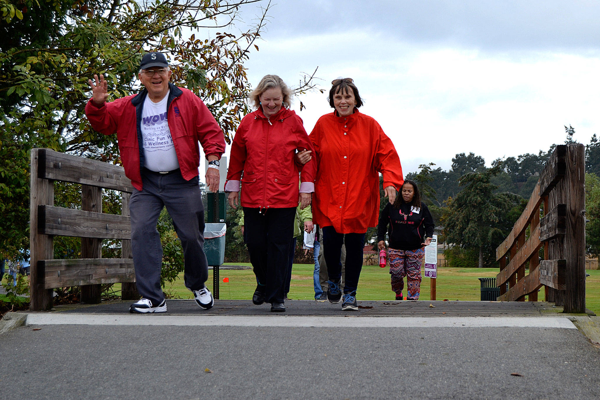 Bill Baughman, Becky Morgan and Linda Christensen walk for Trinity United Methodist Church’s team during the 5K Dungeness Valley Health & Wellness Clinic’s Community Fun Walk on Sept. 8. The trio said it was their first time participating in the walk in a few years. Sequim Gazette photo by Matthew Nash