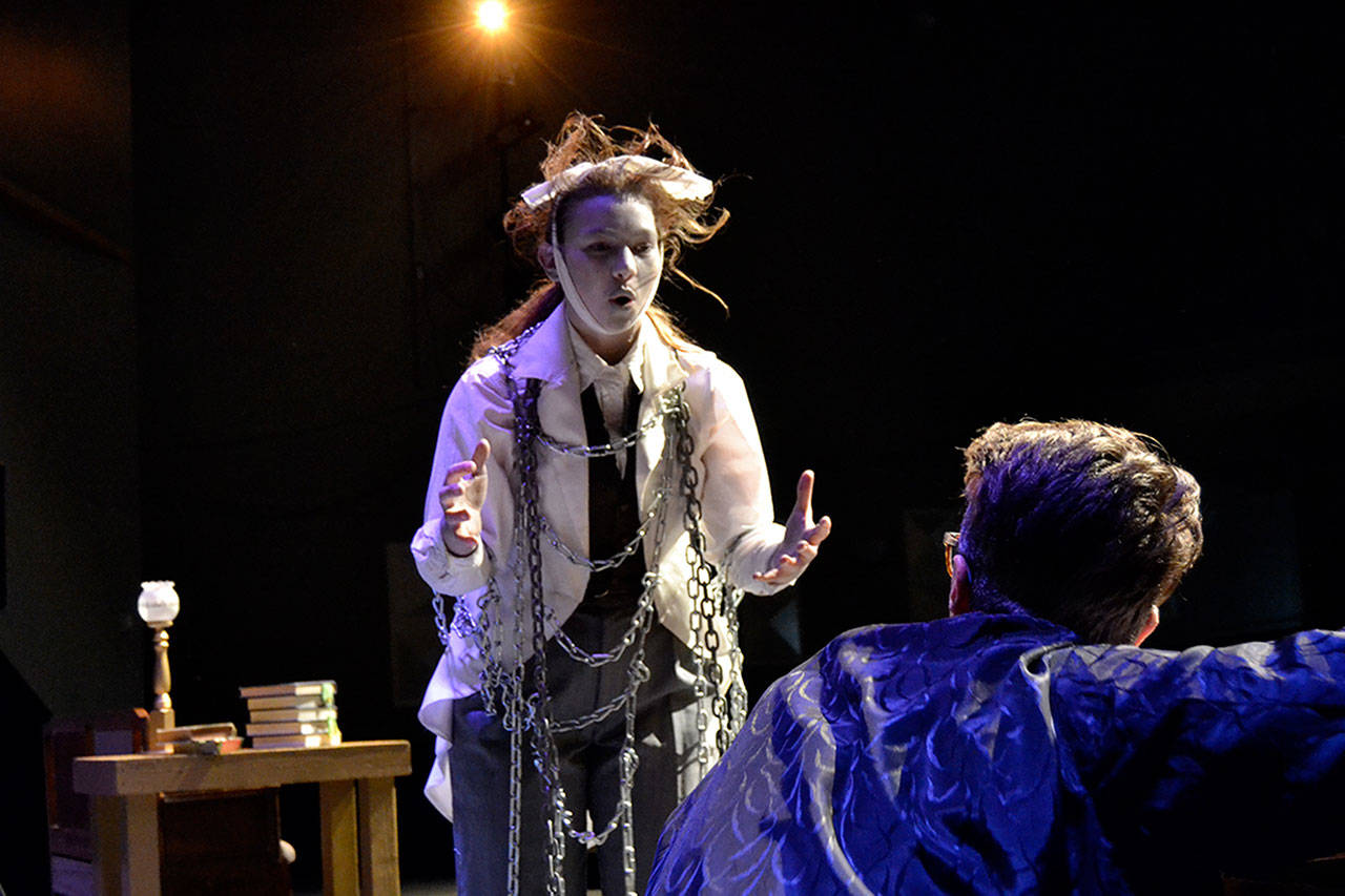 Jacob Marley (Maggie van Dyken) confronts Ebenezer Scrooge (Damon Little) in his home warning him about ghosts coming to visit him in Sequim High School’s production of “A Christmas Carol.” Sequim Gazette photo by Matthew Nash