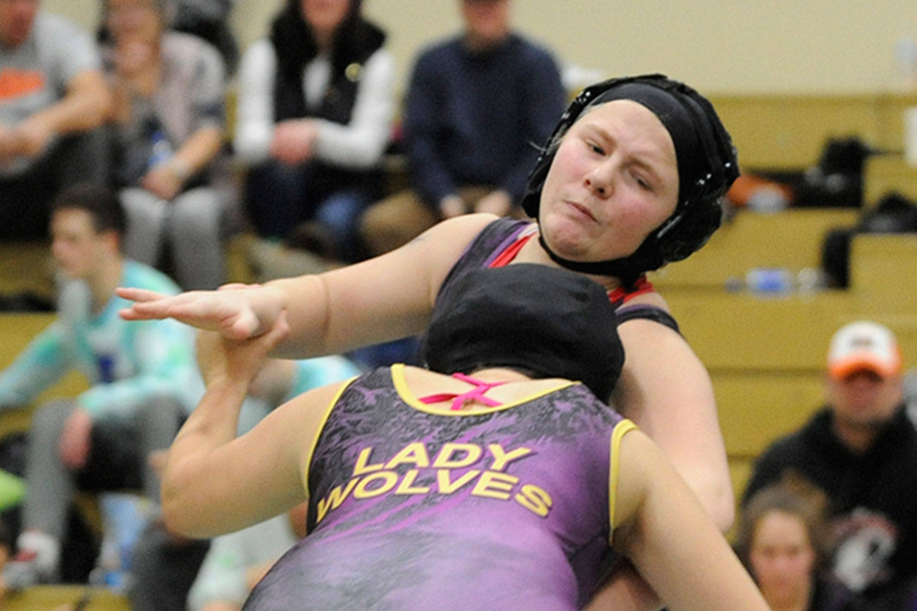 Wrestling: Sequim’s Chen, Eveland advance to regionals