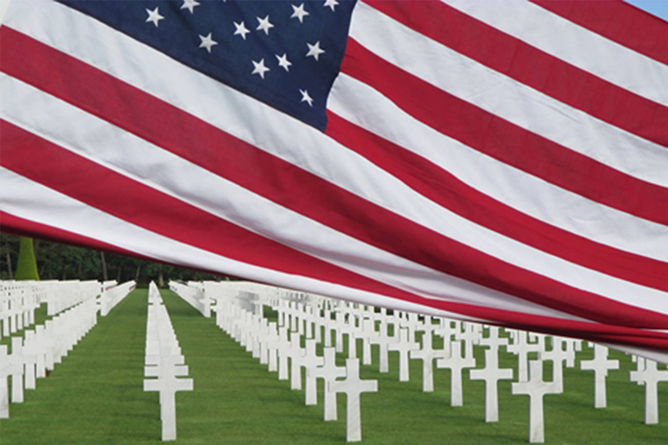 A United States flag is raised over the Normandy American Cemetery in Colleville-sur-Mer, Normandy, France. Photo submitted by Mac Macdonald