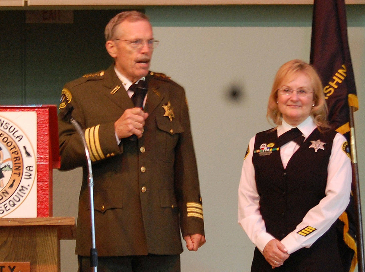 Clallam County Sheriff Bill Benedict congratulates Sylvia Orth, Footprinters of Olympic Peninsula Chapter 74’s 2018 Officer of the Year. Submitted photo