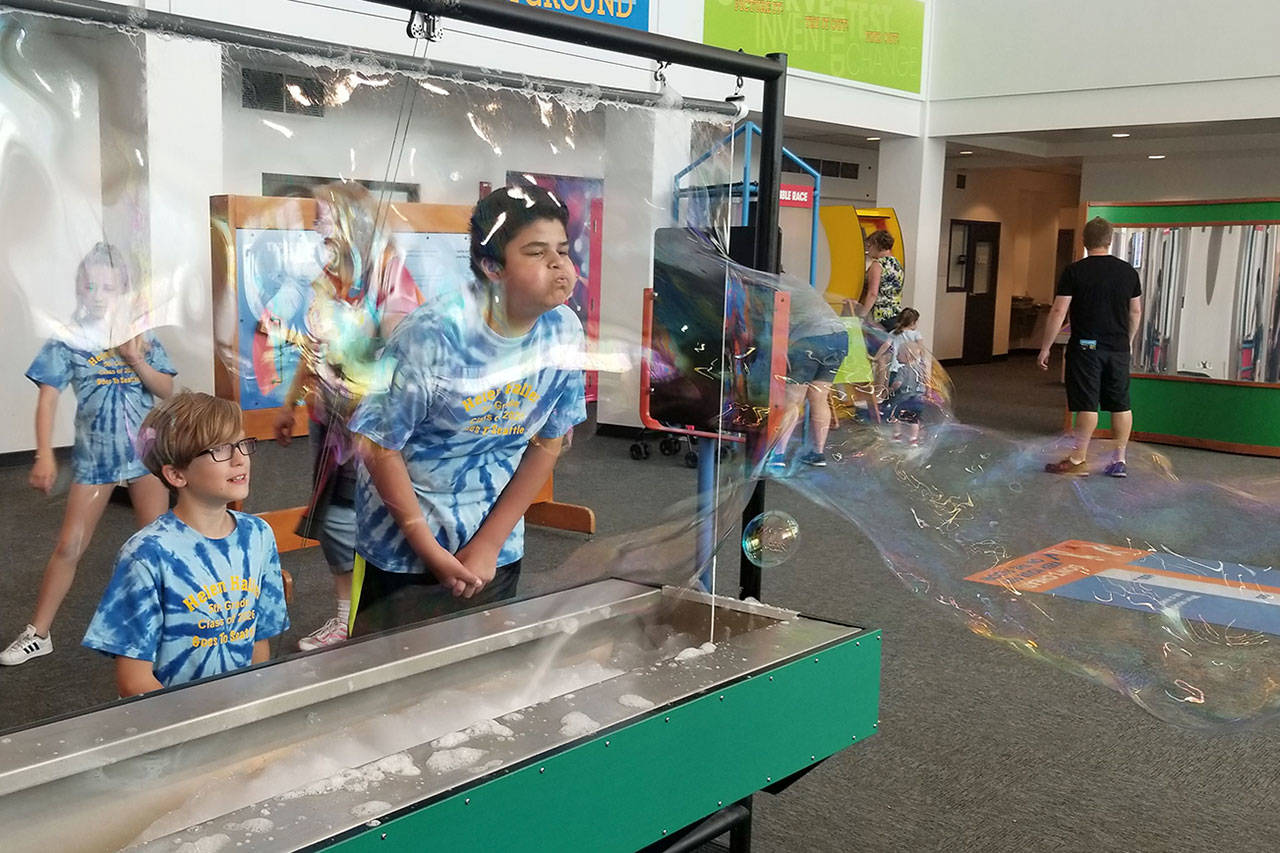 Blake Blanton-Bacchus, left, and Abraham Herrera, Helen Haller fifth-grade students in Eric Danielson’s and Kathryn Baulch’s classes, blow bubbles during a field trip to the Pacific Science Center. Submitted photo