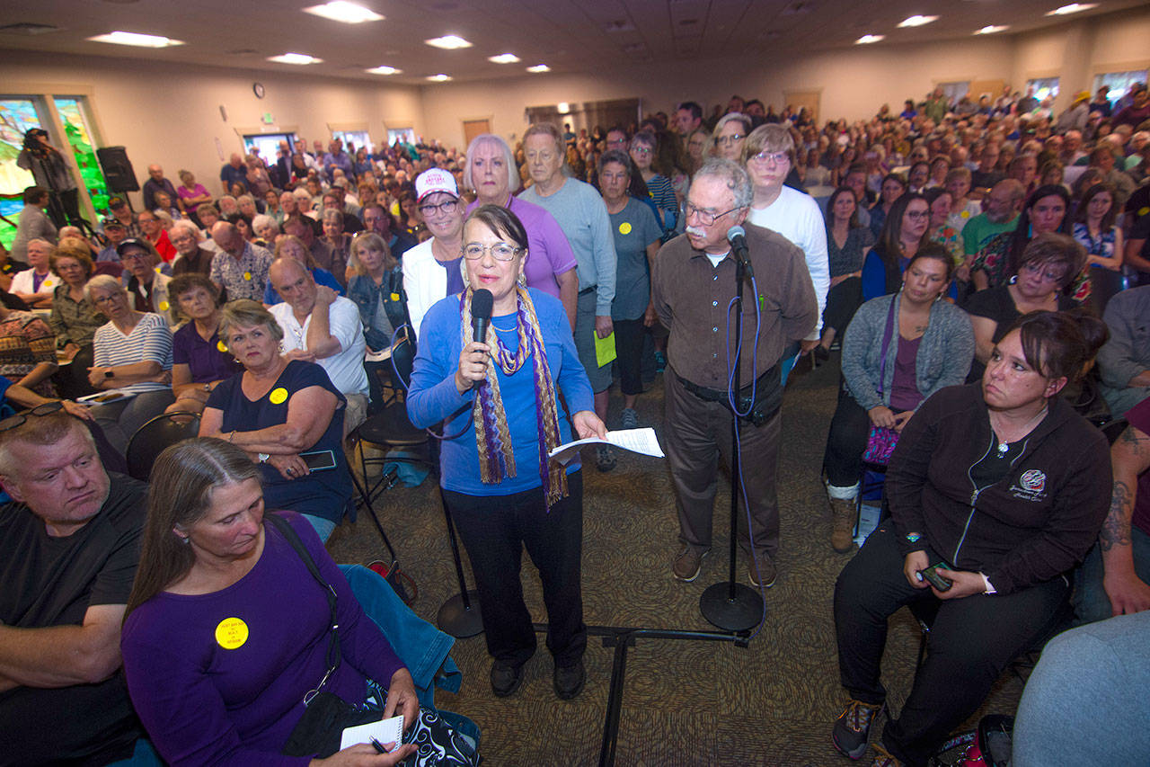 Wendy Goldberg, a member of Save our Sequim, was first to speak when the Jamestown S’Klallam Tribe opened the meeting to questions and statements from the public Thursday. Photo by Jesse Major/Peninsula Daily News