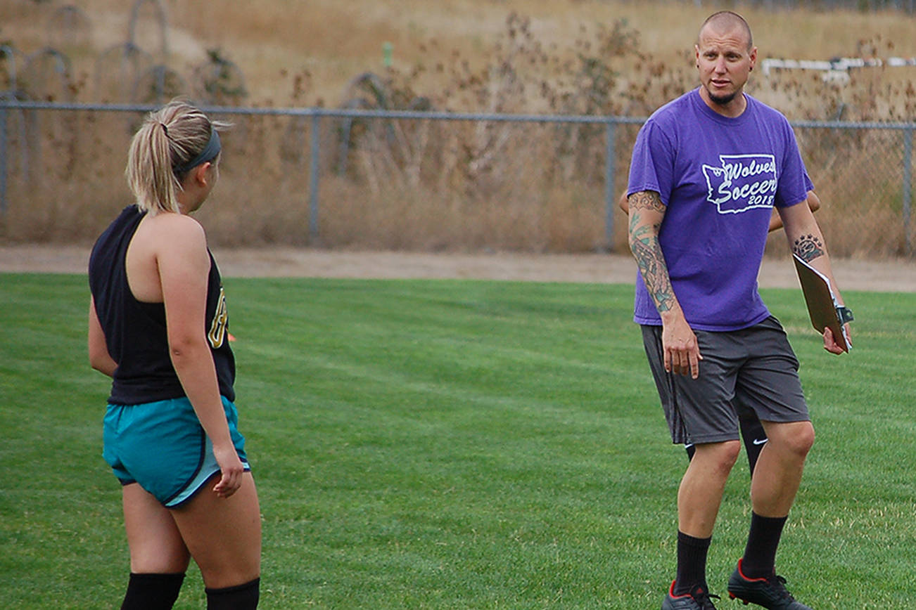 Head coach Derek Vander Velde gives tactical instructions to his players during a possession drill at a girls soccer practice this summer. “We’ve got a few new things that we’ll be doing this season,” he said. Sequim Gazette photo by Conor Dowley