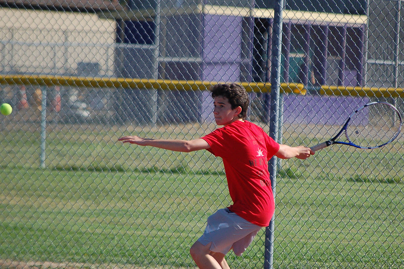 Sequim High School junior Dustan Koch waits to strike a ball at a boys tennis practice in September. Head coach Mark Textor named Dustan as one of the players he’s expecting to step up after nine core players from last year’s team graduated, including all five who went to 2A state tournaments. Sequim Gazette photo by Conor Dowley