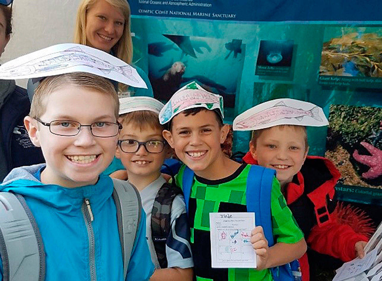 Helen Haller Elementary students Caleb Millet, Dominic Critchlow, Jude Bower and Tyler Arnold learn about fish habitat at the Dungeness River Festival. Submitted photo