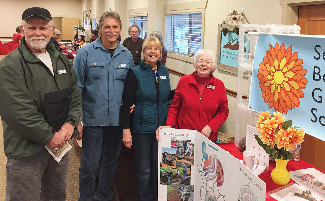 The Sequim Botanical Garden Society hosts a Surprise Peony Pack Fundraising Effort on Dec. 21 at the Sequim Farmers Market Holiday Fair. Pictured, from left, are society members John Hassel, Randy Smith, Sherry Smith and Dona Brock. Submitted photo