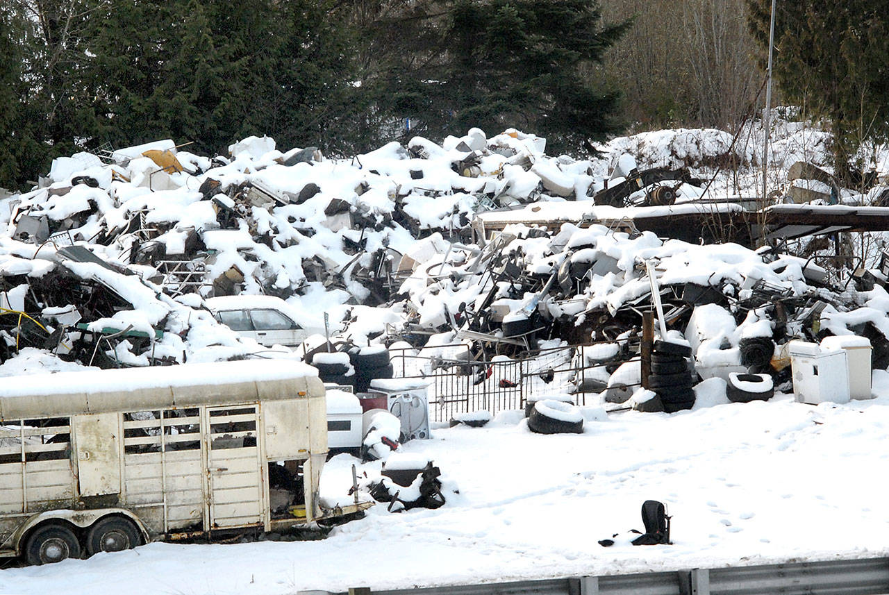 Heaps of discarded appliances and scrap metal lay covered in snow on Jan. 18 at Midway Metals, 258010 Highway 101 between Sequim and Port Angeles. Photo by Keith Thorpe/Olympic Peninsula News Group