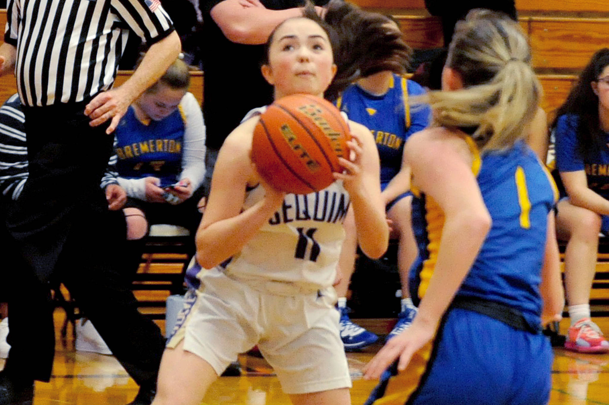 Sequim Wolves guard Hannah Bates sets up to take a shot in the first quarter of the Wolves’ 85-16 win over the Bremerton Knights on Jan. 24. Bates scored 15 points off the bench with impressive defense, snagging seven steals. Sequim Gazette photo by Conor Dowley