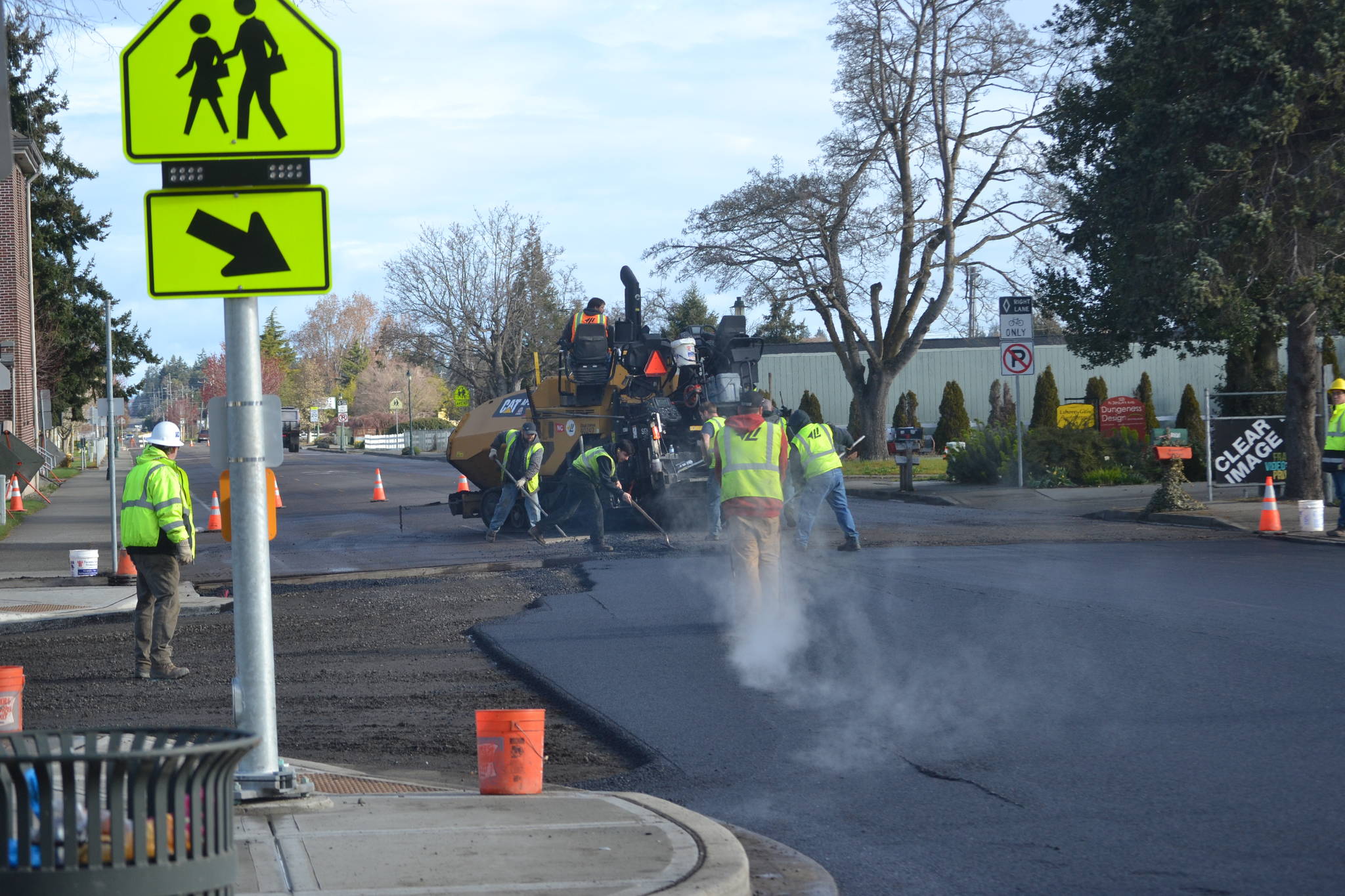 Lakeside Industries and Interwest Construction plan to start and finish paving West Fir Street this week. They started March 31 at the intersection of West Fir Street and North Sequim Avenue. Sequim Gazette photo by Matthew Nash