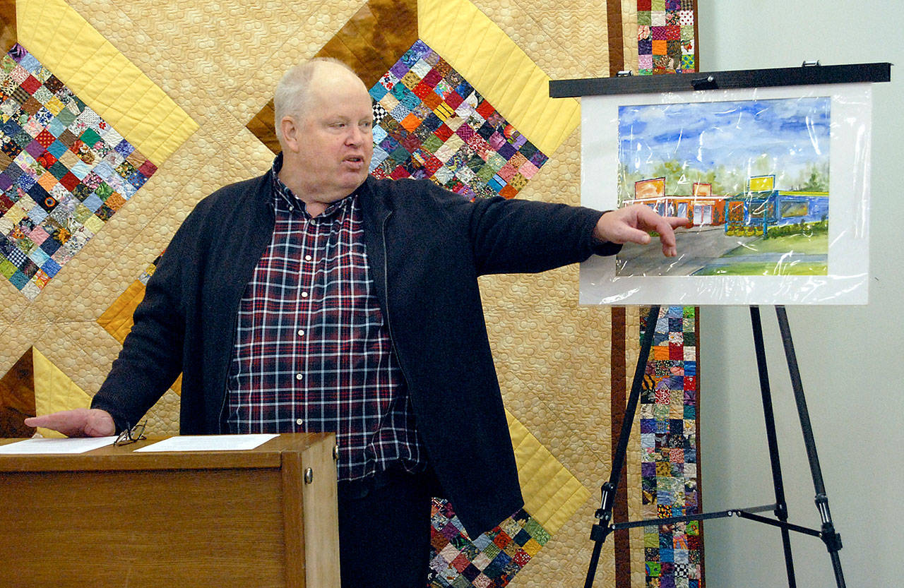 Richard “Doc” Robinson, executive director of Serenity House of Clallam County, points to an artist’s rendering of the Bridges Grill and a nearby laundromat on Eighth Street in Port Angeles that were under consideration for purchase by his agency to provide services for homeless young adults in this Dec. 15, 2018, file photo. Robinson has left his post at Serenity House. Photo by Keith Thorpe/Olympic Peninsula News Group