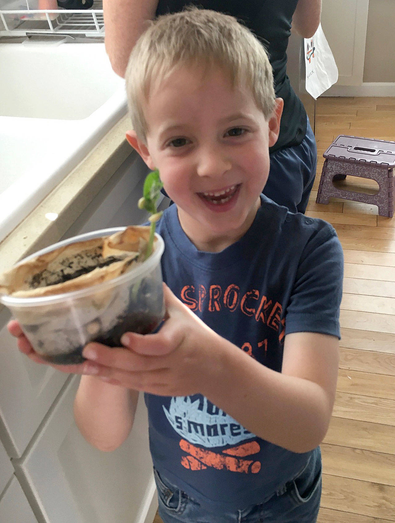 Kindergartener Hank Kalmar is pleased with the root viewer he planted. Photo courtesy of Susan Kalmar