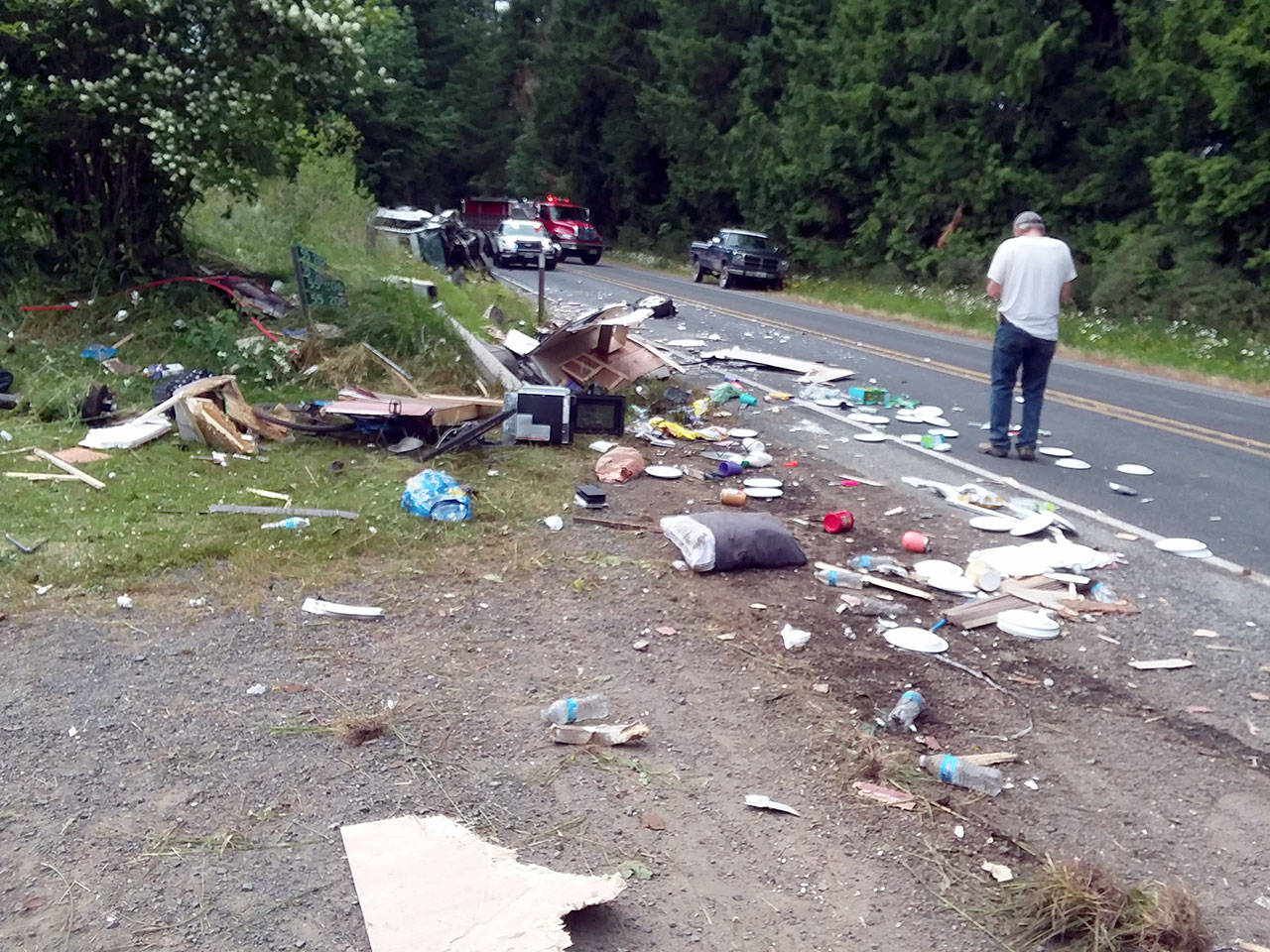 Debris was scattered along state Highway 112 near Dodger Lane after a June 26 two-car collision. Submitted photo