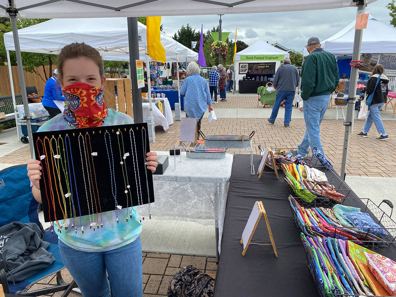 Ruby Romano, 16, offers her beadwork artistry each Saturday during the Sequim Farmers & Artisans Market season. Photo by Emma Jane Garcia