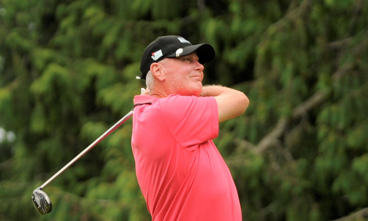 Mike Mullikin of Sequim tees off on the second hole of the 2020 Clallam County Amateur Championship Saturday.