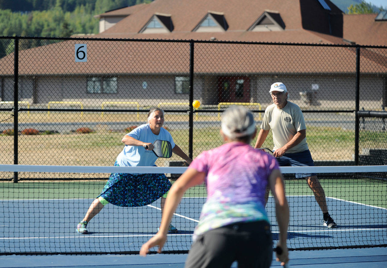 Gayle Powers and Jim Buerer team up for doubles pickleball play at Carrie Blake Community Park on Aug. 14. Sequim gazette photo by Michael Dashiell