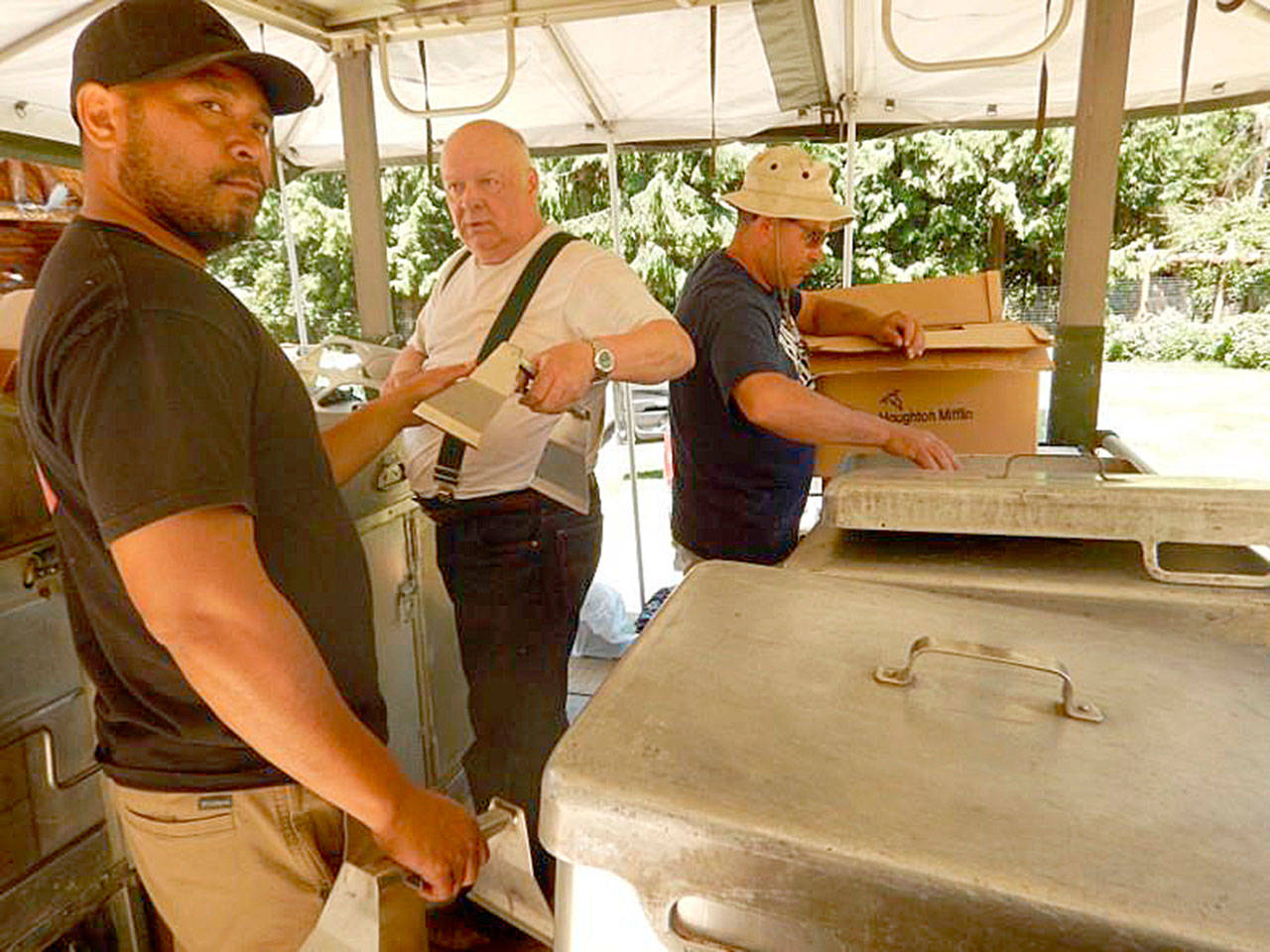 From left, Makah Emergency Manager Rickson Kanichy, and Jim Buck, Joyce Emergency Planning and Preparation chairman Jim Buck and neighbor John Deluna conduct an inventory of an MKT-99 kitchen. Submitted photo