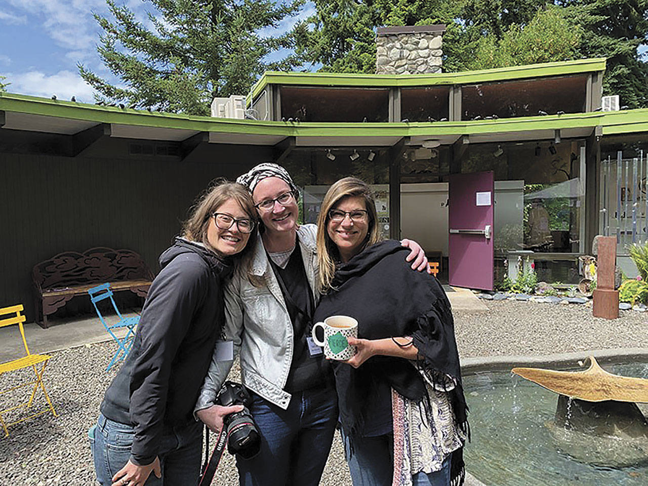 The Port Angeles Fine Arts Center staff — from left, community outreach coordinator Lauren Bailey, gallery/program director Sarah Jane and executive director Jessica Elliott — enjoy the 2019 Summertide Festival. Photo courtesy of Port Angeles Fine Arts Center