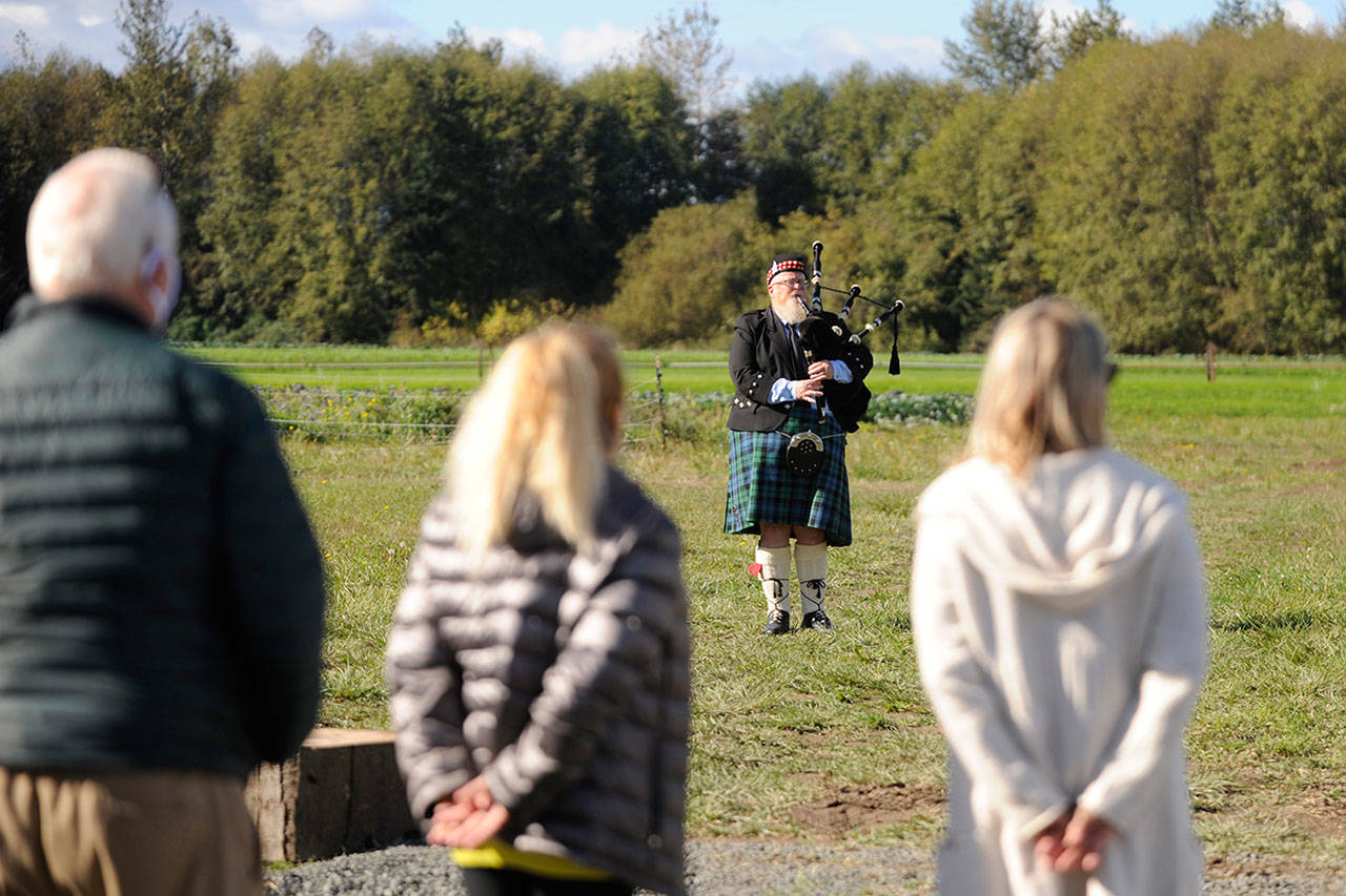 Erik Evans of Port Angeles entertains a small gathering at River Run Farm in Sequim on Oct. 14. Evans started performing short Scottish bagpipe performances, mostly in Port Angeles and some in Sequim, since the COVID-19 pandemic struck earlier this year. Going under the moniker Parking Lot Pipers, Evans is occasionally joined by one or two other musicians —including Dr. Tom McCurdy — as they entertain people in parking lots at various venues where people listen for a few minutes and go about their day. “People seem to like it so I’m going to continue to play,” Evans said last week. Evans is available, as his business card notes, for “weddings, funerals, divorces and other special occasions.” See www.facebook.com/parkinglotpiper. Sequim Gazette photo by Michael Dashiell