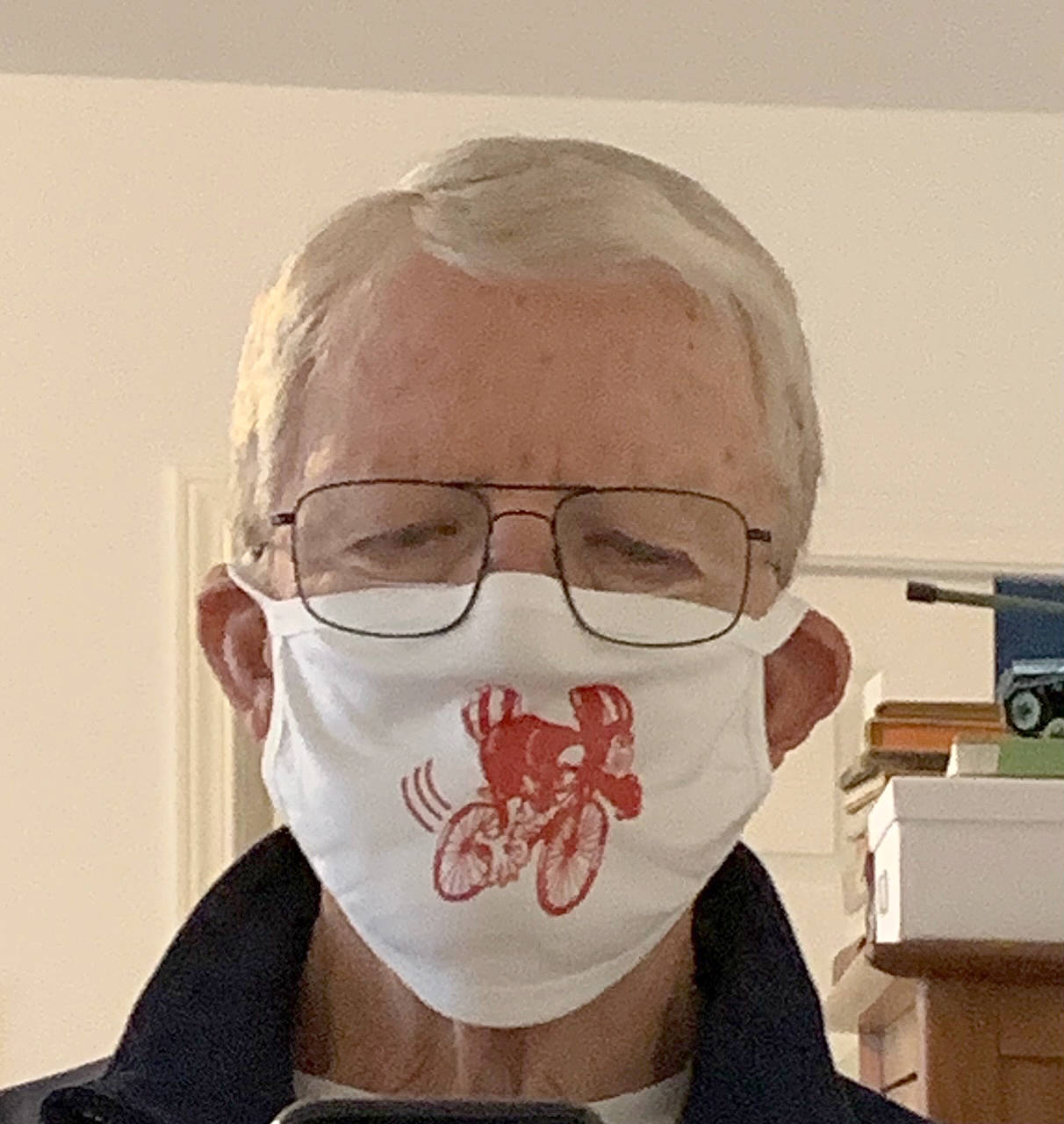 Sequim Cranksgiving organizer Tom Coonelly models a mask that goes to each person who donates to the Sequim Food Bank as part of the 2020 Cranksgiving event. Submitted photo