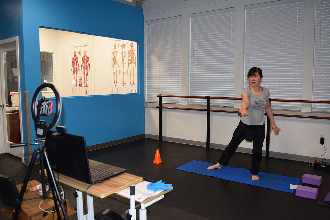 YMCA fitness instructor Kitty Sokkappa leads a virtual fitness class at the YMCA of Sequim. YMCA facilities in Sequim and Port Angeles opened on Jan. 18 following release of Phase 1 “Healthy Washington” guidelines. Photo by Erin Hawkins/Olympic Peninsula YMCA