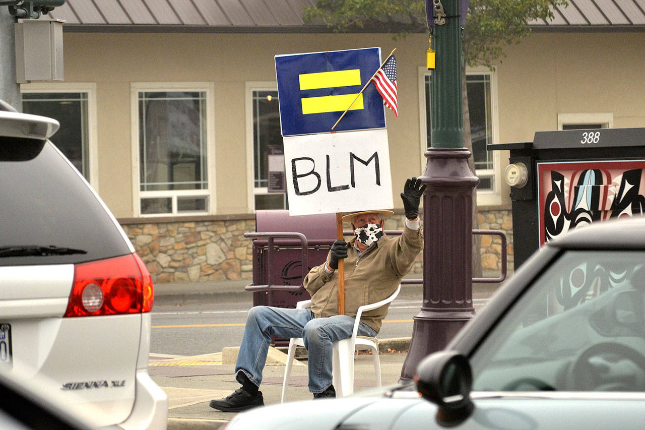 Due to health reasons, Neil Morris of Sequim stopped advocating in downtown Sequim. His wife said he hopes to return after physical therapy in the coming months. Sequim Gazette file photo by Matthew Nash