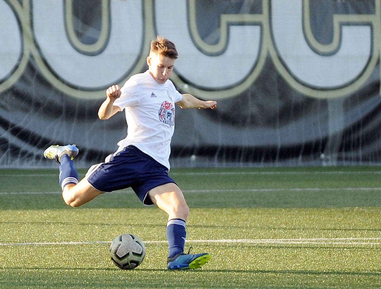 Sequim’s Eli Gish, right, pictured here playing for the Storm King U19 team, recently signed a letter of intent to play at Corban University. Sequim Gazette file photo by Michael Dashiell