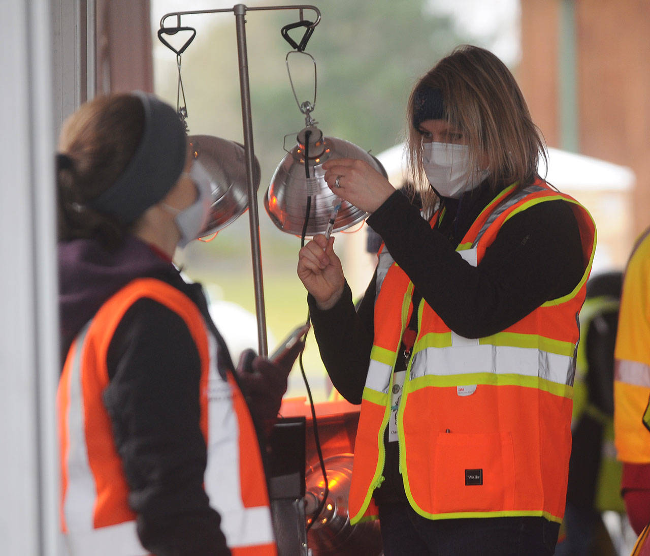 Nurse Charissa Decker prepares a vaccination shot at the Jamestown Family Health Clinic vaccination drive-thru clinic on Feb. 4. Sequim Gazette photo by Michael Dashiell