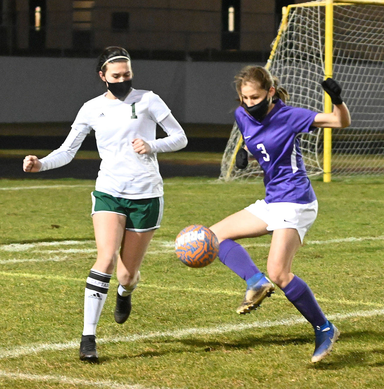 Port Angeles’ Bailee Larson, left, and Sequim’s Taryn Johnson vie for the ball in PA’s 2-1 win at Sequim on Feb. 26. Sequim Gazette photo by Michael Dashiell