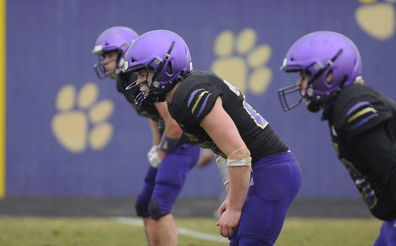 Sequim High’s football squad saw three defensive players earn spots on the all-Olympic League North Division team, including linebackers Isaiah Cowan (center) and Walker Ward. Sequim Gazette file photo by Michael Dashiell