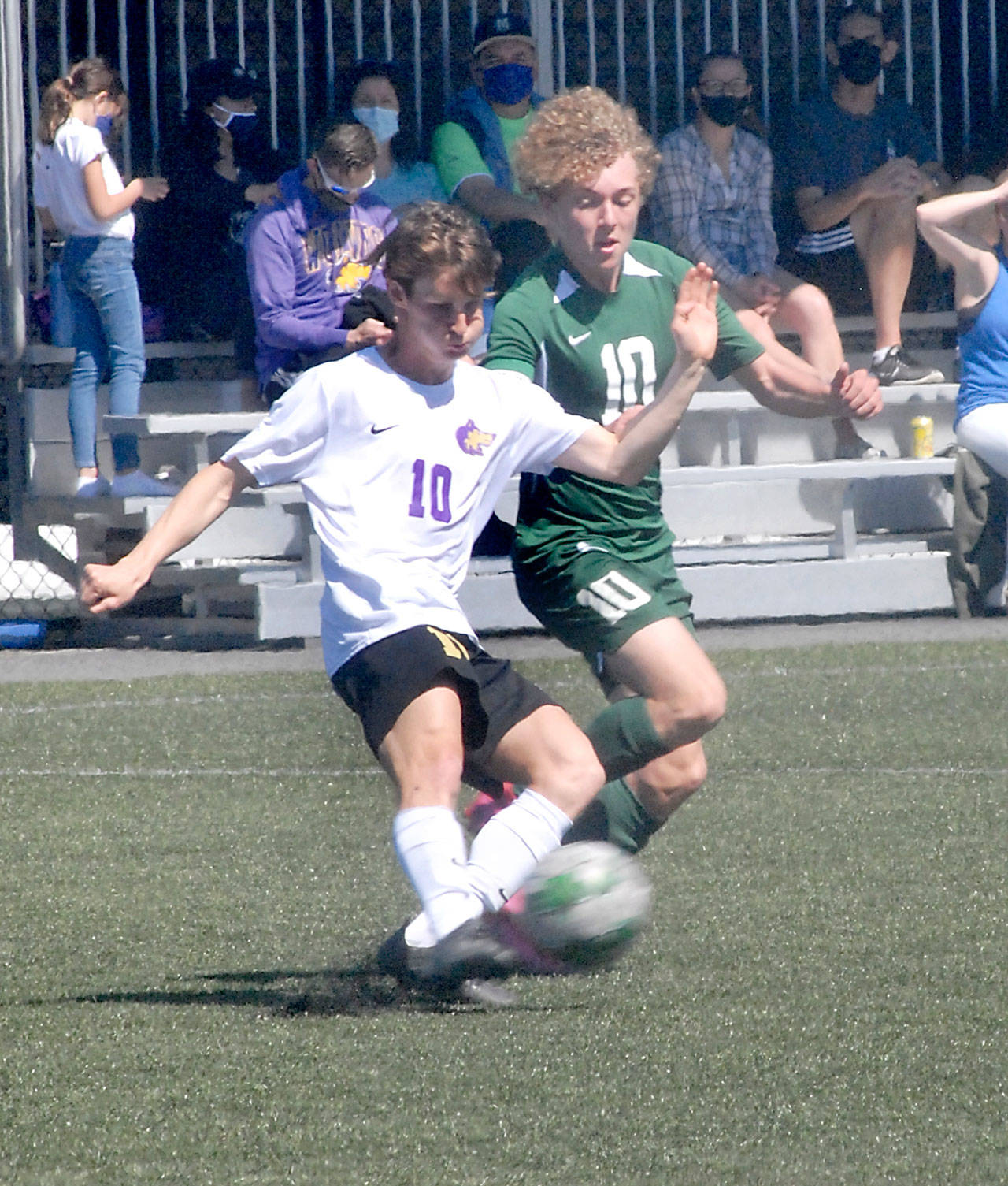 Sequim’s Eli Gish, left, and Port Angeles’ Damon Gundersen compete for control at midfield at Peninsula College on April 17. Photo by Keith Thorpe/Olympic Peninsula News Group