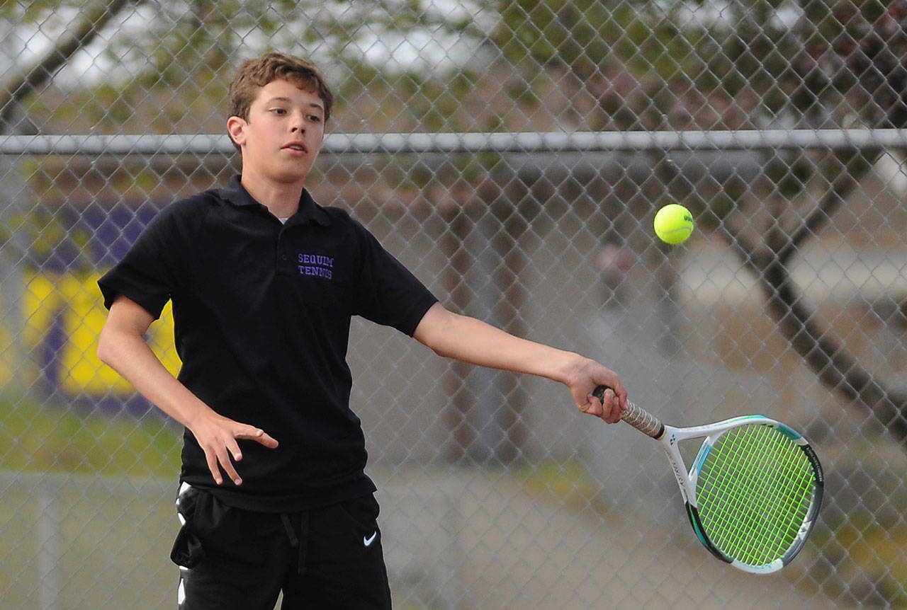 Sequim freshman Garrett Little, pictured here returning a shot against a North Mason foe on May 10, comes into the season the Wolves’ top singles player. Sequim Gazette photo by Michael Dashiell