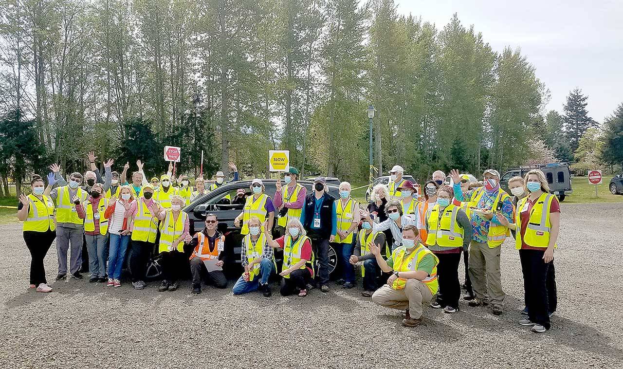 Jamestown Family Clinic workers and Community Emergency Response Team volunteers celebrate the final day of the mass vaccination drive-thru clinic on April 29 at Carrie Blake Community Park in Sequim. Submitted photo