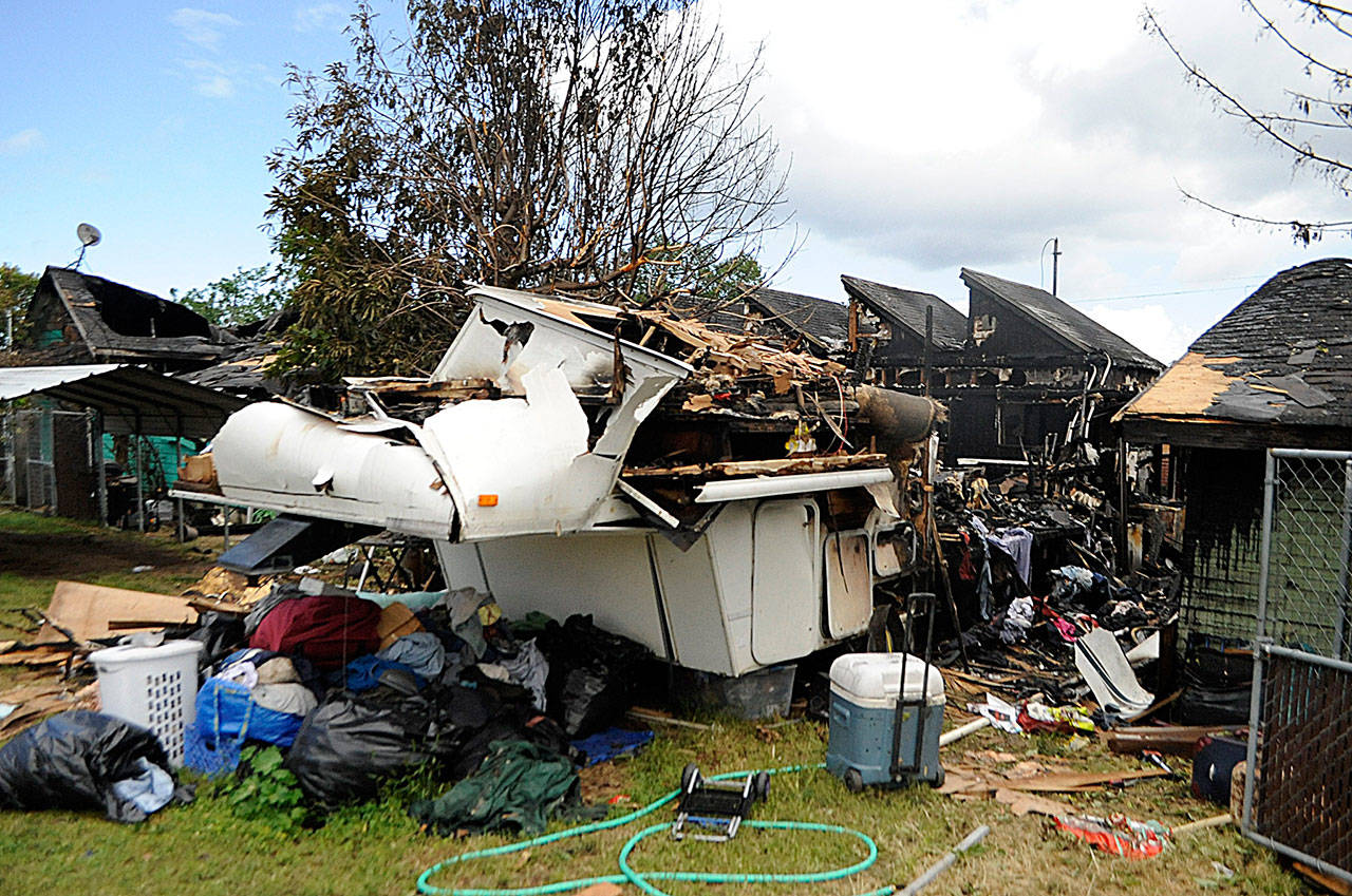 An early Sunday morning fire left a residence and a trailer on West Spruce Street uninhabitable, report leaders with Clallam County Fire District 3. Sequim Gazette photo by Matthew Nash