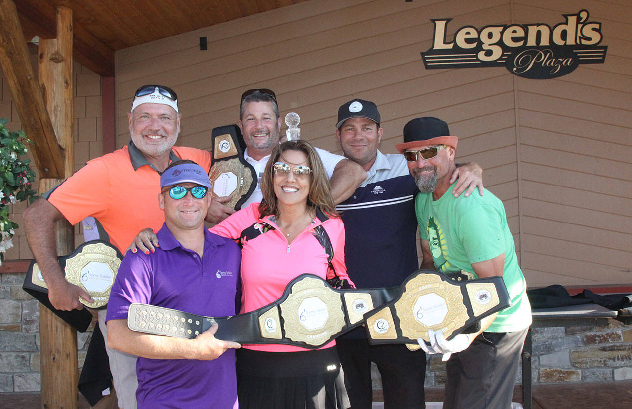 The Irwin Dental Team celebrates a win at the 10th Sonny Sixkiller UW Husky Celebrity Golf Classic golf tournament on July 30. The team includes (back row, from left) Todd Irwin, Jason Doig and Jake Tisdale, with (bottom row, from left) Husky celebrity Joe Jarzynka, team manager Paula Allen and Matt Averill. Photo courtesy of Olympic Medical Center Foundation