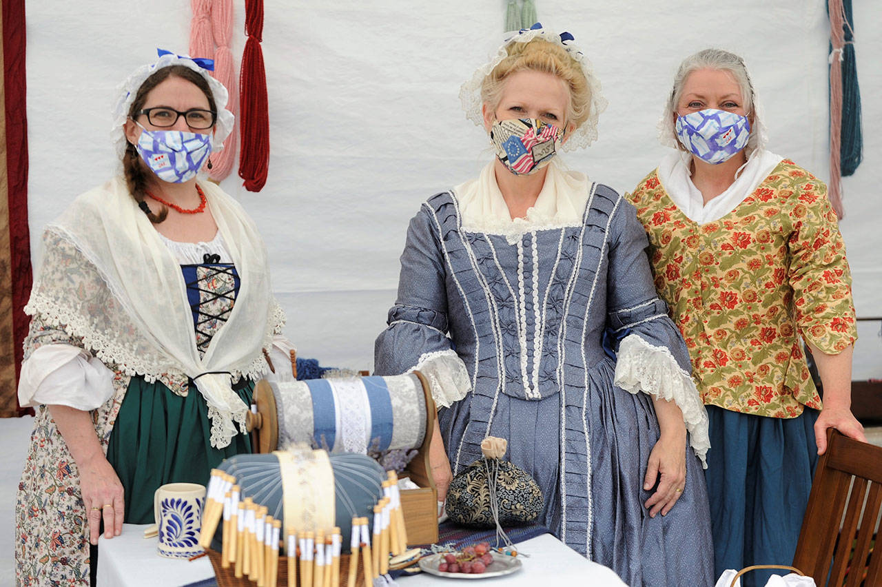 At last year’s Northwest Colonial Festival, members of the Mary Ball chapter of the Daughters of the American Revolution, from left, Coral Hileman of Federal Way, Pam Gassman of Tacoma and Lori Gibson of Oakville, enjoy some time together as they discuss garments from the 1770s. Sequim Gazette photo by Matthew Nash