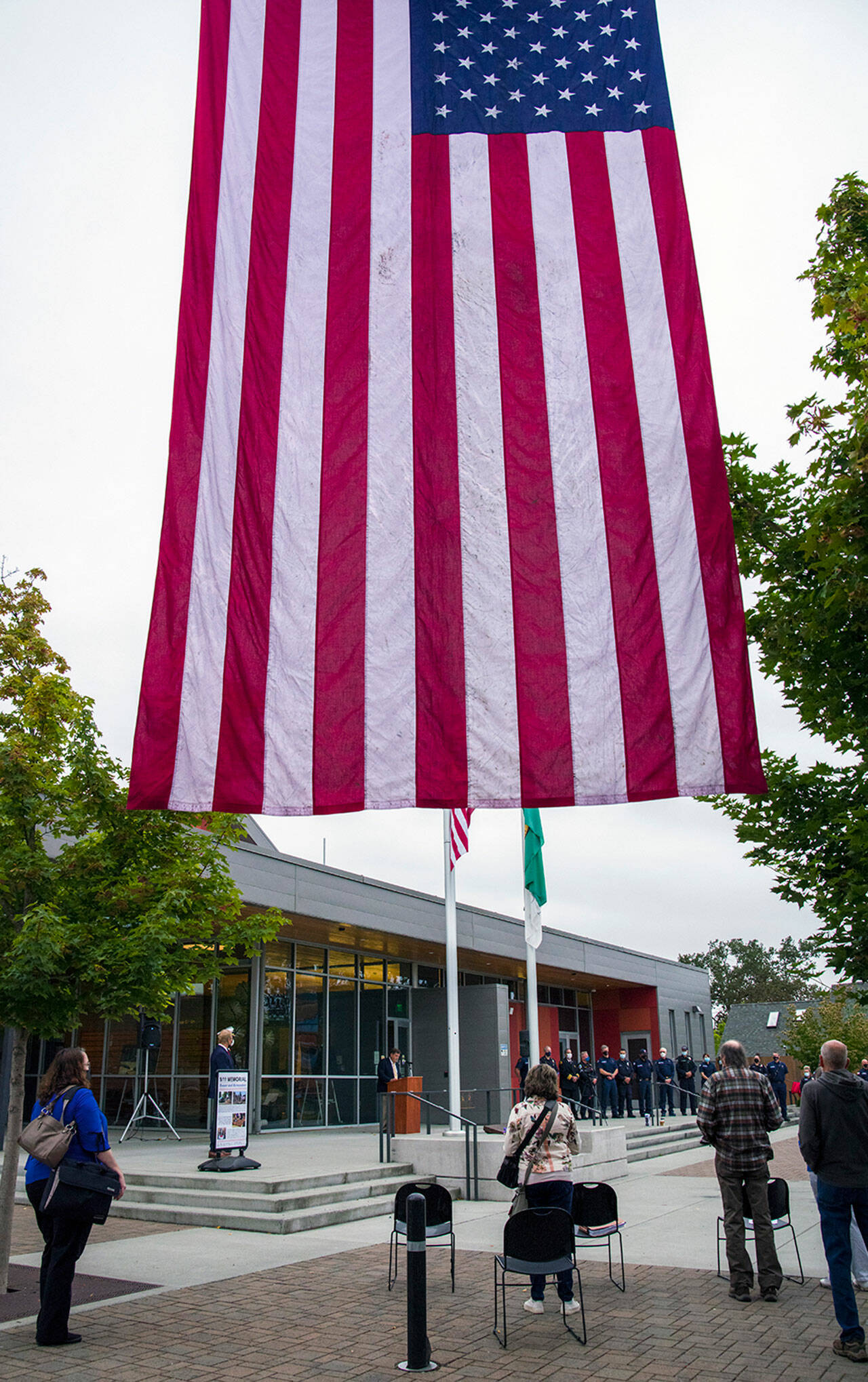 A small crowd gathers at the Sequim Civic Center Friday morning to join Sequim Police, Clallam County Fire District 3 and City of Sequim staffers in remembering the attacks on Sept. 11, 2001. Sequim Gazette photo by Emily Matthiessen