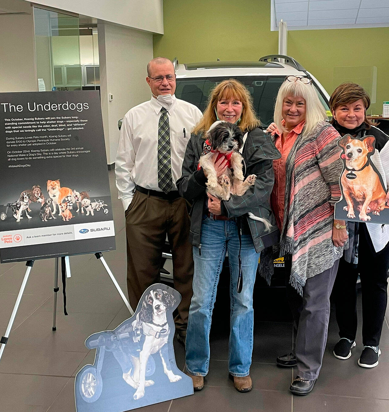 From left: Ken Cardella, Patty Mendenwald and Nadean Portner of Koenig Subaru celebrate the business’ third Make a Dog’s Day with Luann Hinkle, executive director at Olympic Peninsula Humane Society. Submitted photo