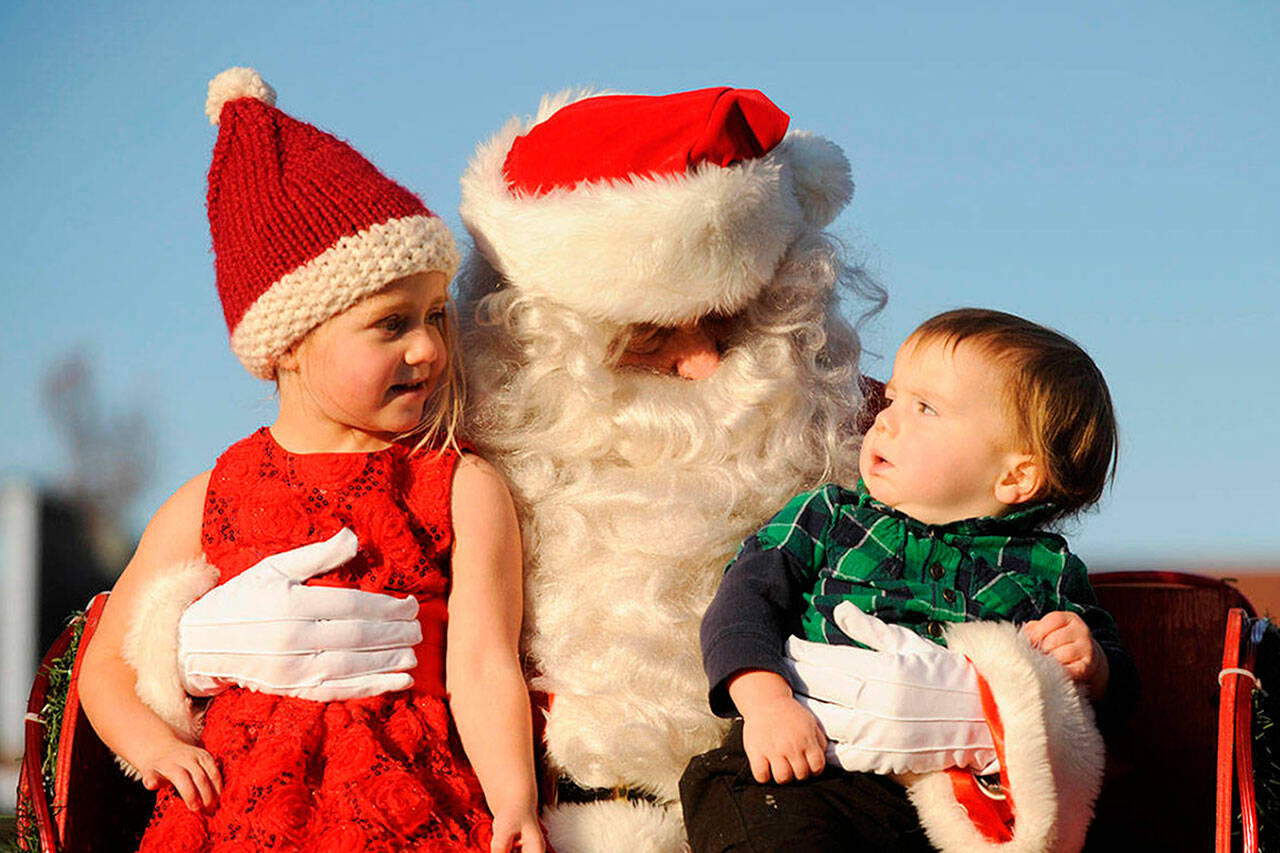 In 2019, Santa Claus, who looks suspiciously like Joe Borden, meets with Zealand and Angus Higgs at the Home Town Holidays event. Sequim Gazette photos by Michael Dashiell 2019