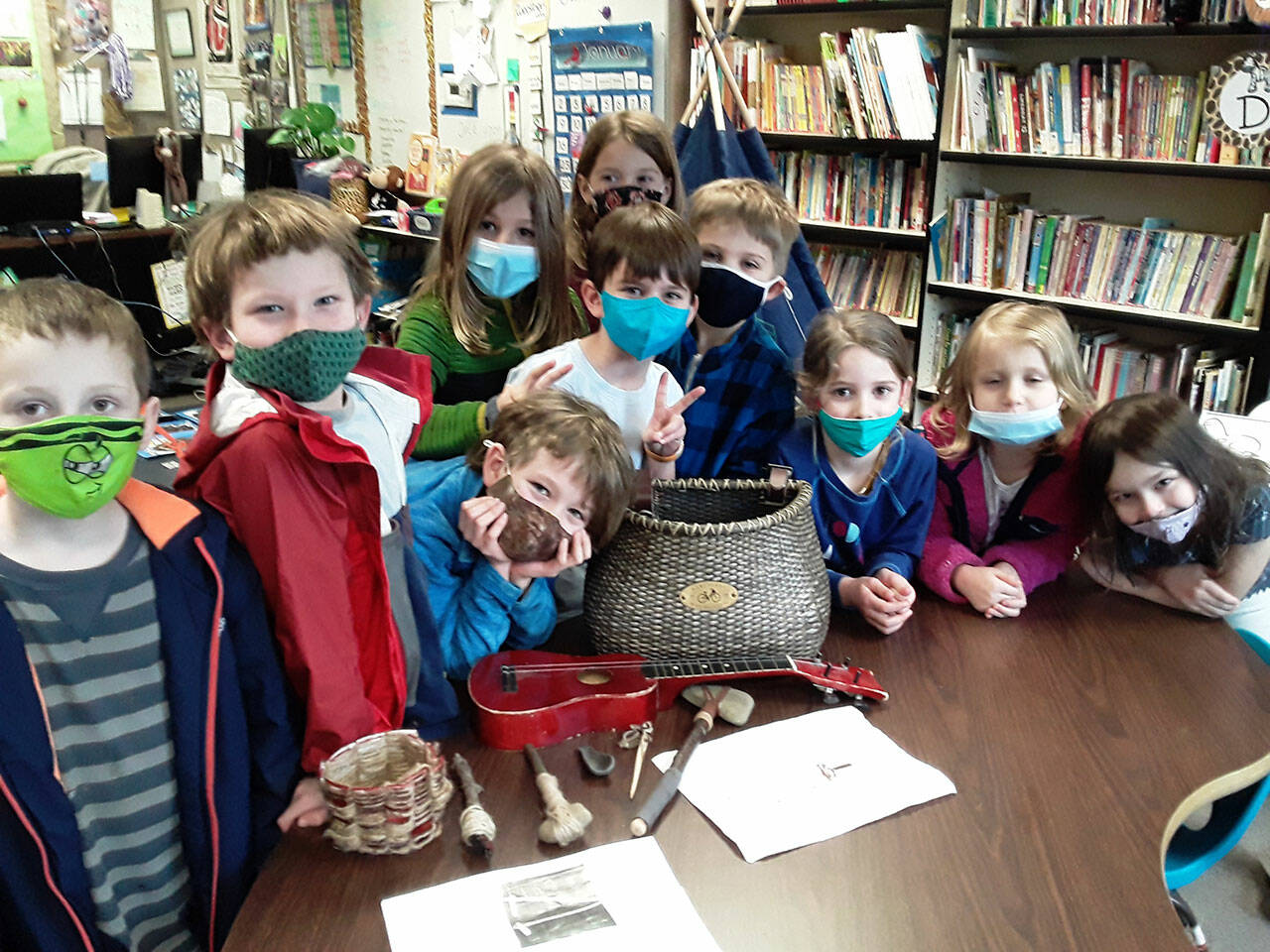 Kindergarten and first-grade students research and create tools that Native Americans used in a recent lesson at Olympic Peninsula Academy. Submitted photo